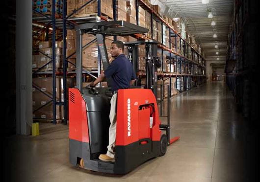 Raymond 4250 Stand Up Counterbalanced Truck Driving in Aisle