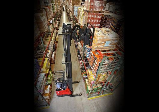 Raymond deep reach forklift in narrow aisle warehouse